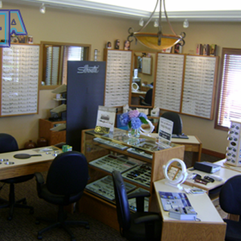 Holmes Construction - an eyeglass shop with a lot of glasses on the wall - General Contractors Near Me - Marion, Illinois Holmes Construction - an eyeglass shop with a lot of glasses on the wall - General Contractors Near Me - Marion, Illinois