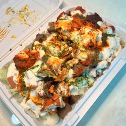 Shah's Halal Food - Combo over rice with white sauce, red sauce and green sauce