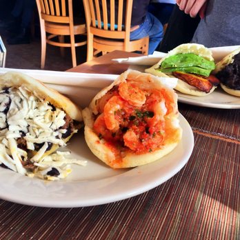 Arepas Cafe - from left :arepa con pabello (steak, black beans & cheese), spicy shrimp, avocado and yucca/plantain, black bean and cheese - Venezuelan Near Me - Astoria, New York