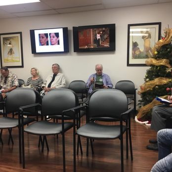 Kevin Dawson - Waiting area, lots of chairs. 2 screens behind me as well. 4 screens total 2 for regular tv shows and 2 for before and after photos. - Dermatologists Near Me - Honolulu, Hawaii