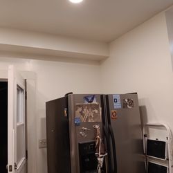 Raineys Construction and Cleaning - Ceiling complete with installed can lights, drywall hung and finished, and painted