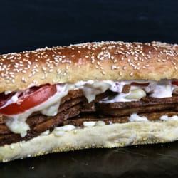 Tofu Hero- Sautéed Marinated Tofu, Aged Cheddar, Onions, Tomato and Mayonaise