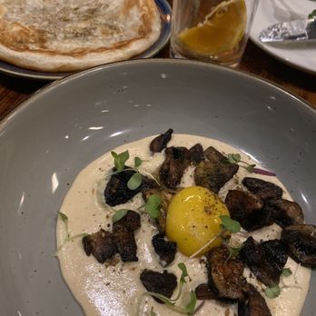 El Raval - Hummus with mushroom & egg yolk paired with buttery roti - yummmmmm! - Spanish Near Me - Austin, Texas El Raval - Hummus with mushroom & egg yolk paired with buttery roti - yummmmmm! - Spanish Near Me - Austin, Texas