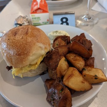Cullum's Attaboy - Bacon, egg, and cheese sandwich with a side of potatoes. - Breakfast & Brunch Near Me - San Antonio, Texas