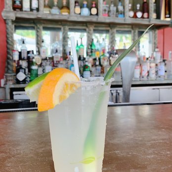 Cantina Beach - a glass of lemonade with a straw and a slice of orange - Mexican Near Me - Key Biscayne, Florida