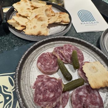 Kaasbar Amsterdam - Salami and mini pickles. House crackers. - Bars Near Me - Amsterdam, New Hampshire