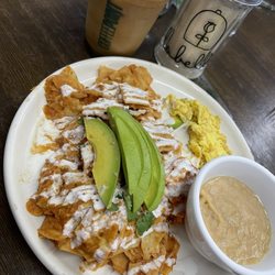 Labelle - Red chilaquiles served with ice Carmel macchiato w/ avena milk