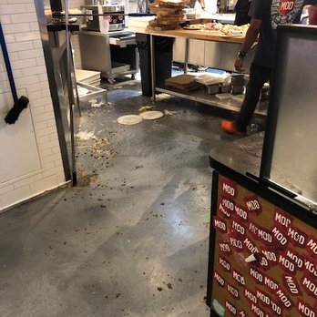 MOD Pizza - Food all over the floor in front of the pizza oven and in the food prep area. - Fast Food Near Me - Matthews, North Carolina MOD Pizza - Food all over the floor in front of the pizza oven and in the food prep area. - Fast Food Near Me - Matthews, North Carolina