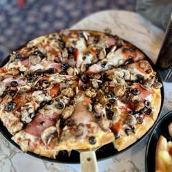 Pizza Caboose - Caboose Special Pizza: Salami, Canadian bacon, pepperoni, olives, mushrooms, ground beef, italian sausage.