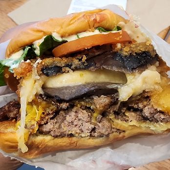 Shake Shack Irvine Spectrum - Inside of the Stack Shack Burger (showing oozing cheese in the center) - Burgers Near Me - Irvine, California Shake Shack Irvine Spectrum - Inside of the Stack Shack Burger (showing oozing cheese in the center) - Burgers Near Me - Irvine, California