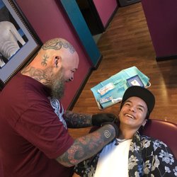 Scott piercing Cameron's second ear. From big eyes and fear to a smile and laughing.