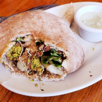 Whole In the Wall - Falafel Pocket with hummus, greens, cuke, and sprouts. - Vegetarian Near Me - Binghamton, New York Whole In the Wall - Falafel Pocket with hummus, greens, cuke, and sprouts. - Vegetarian Near Me - Binghamton, New York
