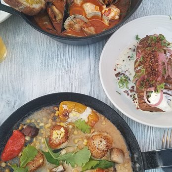 Scales - Seafood stew, loaded hasselback potato and scallops in corn cream sauce. - Seafood Near Me - Portland, Maine