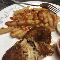 Amazing food, crab cakes and fries already ate the coleslaw.
