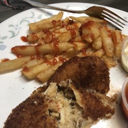 Dom's Seafood - Amazing food, crab cakes and fries already ate the coleslaw.