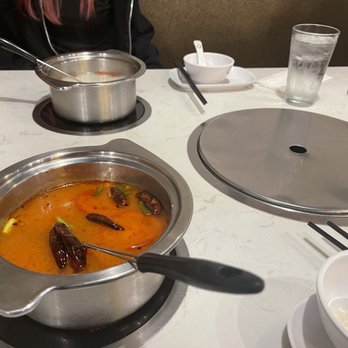 George's Hot pot & bbq - The Spicy Ox tail tomato broth isn't really spicy. It's actually sweet and tangy. The red color is mostly the tomato in it. - Hot Pot Near Me - Gaithersburg, Maryland