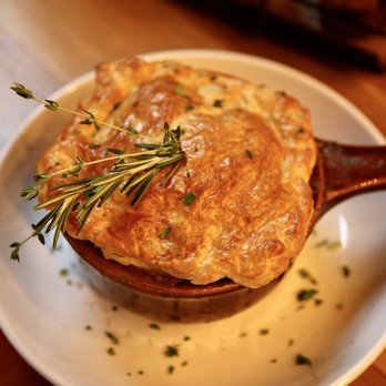 Moonshine Alley - a pot pie on a plate with a sprig of rosemary - Southern Near Me - Providence, Rhode Island