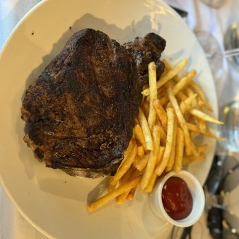 Brick Walk Tavern - 20 oz. New York strip on the bone (no truffle butter for me). Very flavorful! - American Near Me - Fairfield, Connecticut