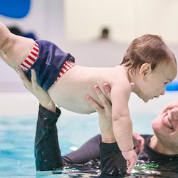 Imagine Swimming - 6 months and swimming like a fish in our parent and me classes!