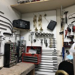 Absolute Music - A wall of our band instrument repair shop.