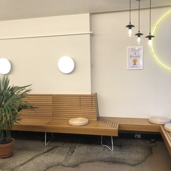 INDAY - a wooden bench and a potted plant - Gluten-Free Near Me - New York, New York INDAY - a wooden bench and a potted plant - Gluten-Free Near Me - New York, New York