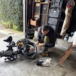 Vadim in my garage, fixing my bike. Vadim in my garage, fixing my bike.