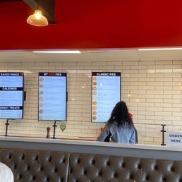 A customer looking at the menu. A customer looking at the menu.