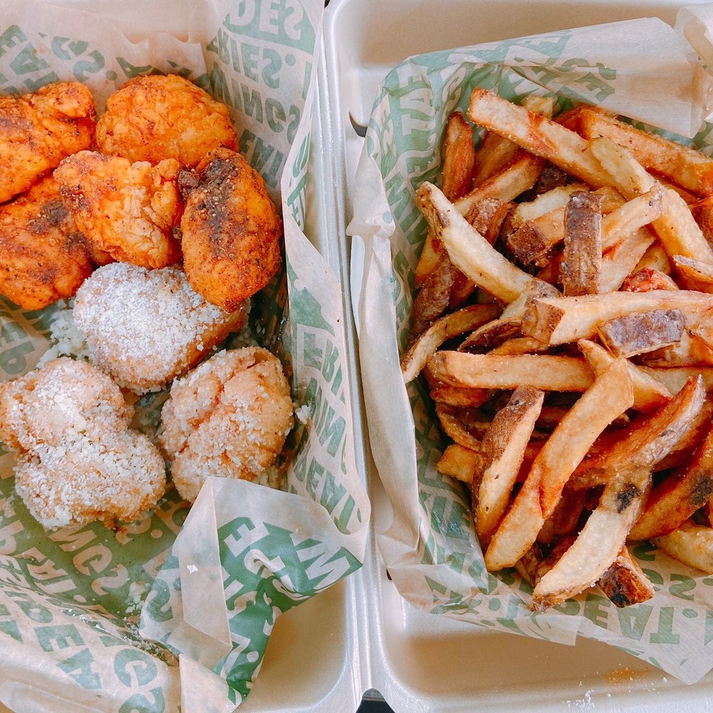 Wingstop - Boneless wings in the louisiana rub and garlic parmesan flavor with seasoned fries - Chicken Wings Near Me - Shelby Township, Michigan Wingstop - Boneless wings in the louisiana rub and garlic parmesan flavor with seasoned fries - Chicken Wings Near Me - Shelby Township, Michigan