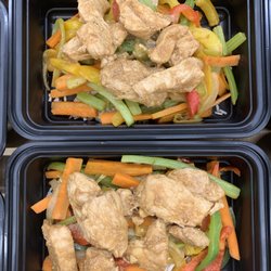 Commence Kitchen - Cashew chicken over stir fried vegetables and rice.
