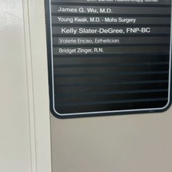 W Dermatology Long Beach - Address card at the entrance to Dr. James Wu's clinic.