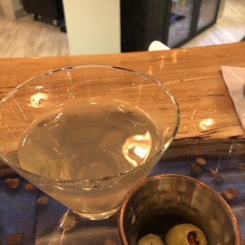 MI Table - Dirty martini minus my olives in the drink because they didn't have toothpicks - New American Near Me - Bay City, Michigan