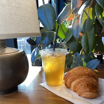 Temple Coffee - Table with Green Jasmine Yin Hao Tea and Butter Croissant - Coffee & Tea Near Me - Sacramento, California Temple Coffee - Table with Green Jasmine Yin Hao Tea and Butter Croissant - Coffee & Tea Near Me - Sacramento, California
