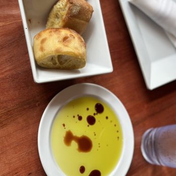 Carmelina's - Complementary bread w/ side of olive oil and balsamic vinegar. THE BEST BREAD - Italian Near Me - Boston, Massachusetts Carmelina's - Complementary bread w/ side of olive oil and balsamic vinegar. THE BEST BREAD - Italian Near Me - Boston, Massachusetts
