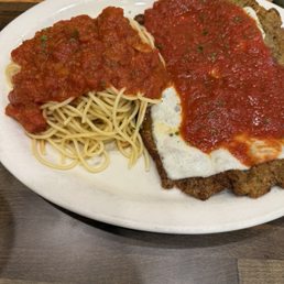 Veal parmigiana with pasta marinara. Veal parmigiana with pasta marinara.