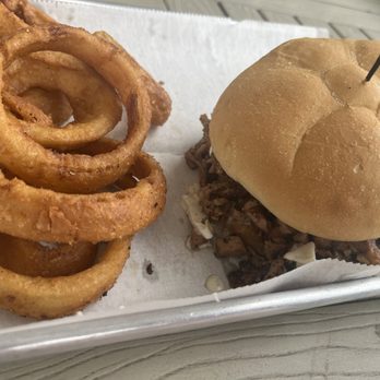 Olde Towne Smokehouse - Brisket sandwich with slaw and onion rings - Barbeque Near Me - Mechanicsville, Virginia Olde Towne Smokehouse - Brisket sandwich with slaw and onion rings - Barbeque Near Me - Mechanicsville, Virginia