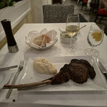 Flagler Steakhouse - Dry Aged Tomahawk Rib Chop - Steakhouses Near Me - Palm Beach, Florida