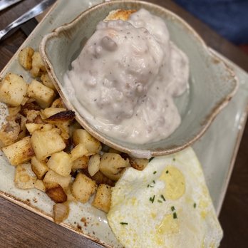 First Watch - Biscuit and turkey gravy with eggs and potatoes - Breakfast & Brunch Near Me - Bentonville, Arkansas First Watch - Biscuit and turkey gravy with eggs and potatoes - Breakfast & Brunch Near Me - Bentonville, Arkansas
