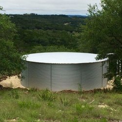 30,000-gallon lined metal rainwater collection tank