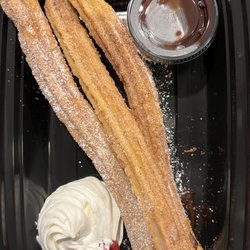 Kensington's Restaurant - Perfectly made Churros to go, with a side of chocolate sauce.