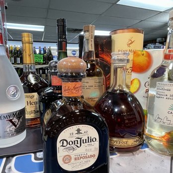 Cheers - a variety of liquor bottles on a bar counter - Beer, Wine & Spirits Near Me - Peachtree City, Georgia Cheers - a variety of liquor bottles on a bar counter - Beer, Wine & Spirits Near Me - Peachtree City, Georgia