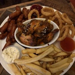 McGinn's Hop House - Sample platter or something like that - little sausages, onion rings, spicy wings and chips with 3 dipping sauces.
