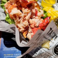 Lobster roll with a side of corn on the cob nibbles
