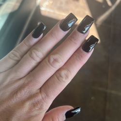 NailStop Spa & Wax - This was what they did when I went back; she painted black gel over the nails and charged me $25. So these are my $75 nails!!