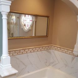 Artistic Concepts - Porcelain tile calcatta marble look with travertine listel and pencil liner