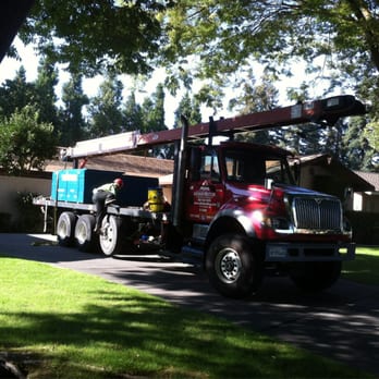 Home Roofing - Big truck delivering the first layer of our new roof! So exciting. This is a conveyer belt that carried each sheet up. - Roofing Near Me - Lodi, California Home Roofing - Big truck delivering the first layer of our new roof! So exciting. This is a conveyer belt that carried each sheet up. - Roofing Near Me - Lodi, California