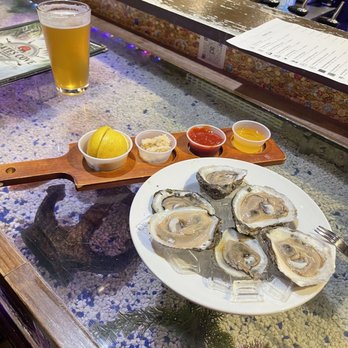 Pirate's Cove - Raw Oysters, draft beer and a shot of the bar. - American Near Me - New Bern, North Carolina Pirate's Cove - Raw Oysters, draft beer and a shot of the bar. - American Near Me - New Bern, North Carolina