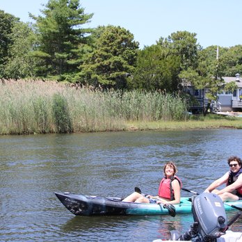 Cape Cod Waterways - Happy couple kayaking - Boating Near Me - Dennis Port, Massachusetts Cape Cod Waterways - Happy couple kayaking - Boating Near Me - Dennis Port, Massachusetts