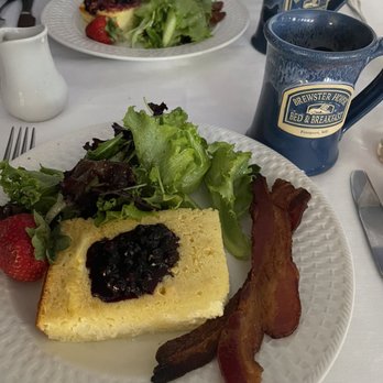Brewster House Bed & Breakfast - Cheese blintz with Maine blueberry compote, Maine bacon, and salad greens with an apricot vinaigrette. - Hotels Near Me - Freeport, Maine Brewster House Bed & Breakfast - Cheese blintz with Maine blueberry compote, Maine bacon, and salad greens with an apricot vinaigrette. - Hotels Near Me - Freeport, Maine