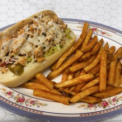 Falafel Factory - Grilled chicken , onions and bell peppers Philly sandwich with a side of fries and a drink