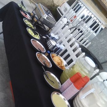 Taco Man Catering - a table full of food - Caterers Near Me Taco Man Catering - a table full of food - Caterers Near Me